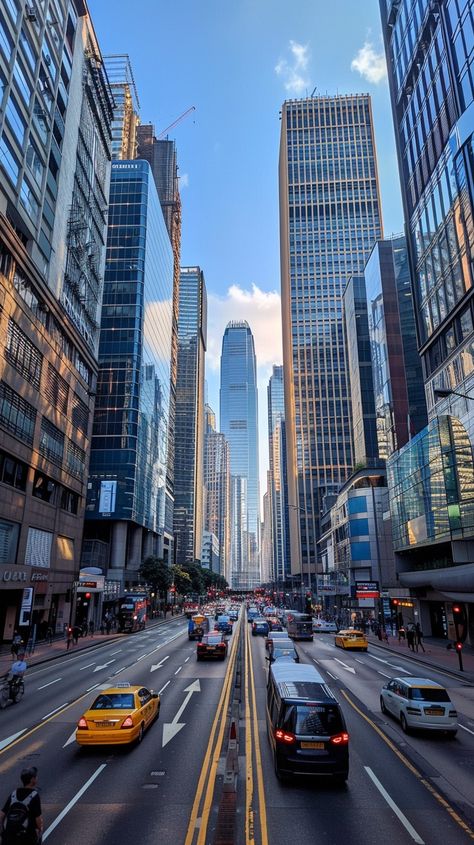 Urban Traffic Scene: #Cars and #Taxis navigate through bustling city streets flanked by towering modern #Skyscrapers at #Dusk. #downtown #bustlingcity #cityscape #urbanlife #eveningtraffic #modernarchitecture #streetscene #citylights ⬇️ Download and 📝 Prompt 👉 https://stockcake.com/i/urban-traffic-scene_717105_1071557 Landscapes Textiles, Downtown City Aesthetic, Urban City Street, Car Traffic, City Reference, Street Landscape, Downtown Buildings, City Traffic, Calendar Inspiration