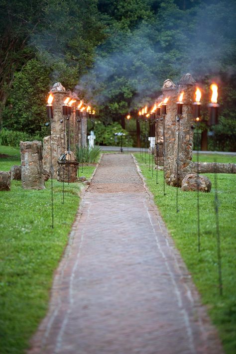 Tiki Torches    Use these torches to provide ambiance to your reception, light paths to the WC or parking areas.  Quantity: 25+  Item #: LOG009 (Stonegate Event Rentals) Tiki Torch Ideas Backyards, Torch Decoration, Bonfire Wedding, Luxury Restroom, Outdoor Event Lighting, Path Lighting, Outdoor Torches, Fire Torch, Welcome Dinner