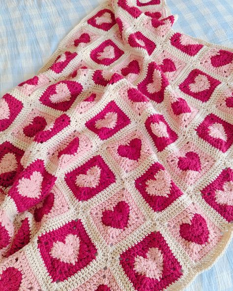 Long awaited update on the heart blanket- it's all finished and has been thoroughly used and loved each day since completion 🥰 for my first ever crochet project I'm stoked with it! . . . #crochetinspiration #crochetblanket #crochetlove #heartgrannysquare #heartblanket #heartcrochet #handmade #crochetdesign #textileart #crochetart #australianartist #femaleartist #artproject Granny Squares With Hearts, Knitting Valentines Day, Cottage Crochet Blanket, Valentines Crochet Granny Square, Galentines Gifts Idea Crochet, Valentine Crochet Blanket, Crochet Colorful Blanket, Valentines Day Crochet Blanket, Cute Valentines Crochet Ideas