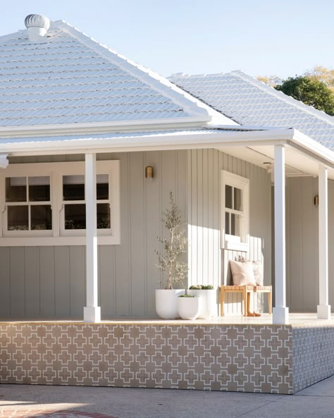 The vertical cladding, trims, eaves and wide window trims used a fresh lick of Dulux Pozieres and Dulux White Dune paint to bring this exterior to life. Weatherboard Exterior, Dulux White, Exterior House Colours, Hamptons House Exterior, Weatherboard House, Roof Restoration, Three Birds Renovations, Porch Tile, House Colours