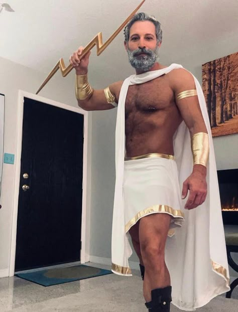 Channel the king of the gods with this Greek god costume guide. Find DIY ideas for crafting Zeus’s signature look or shop for a ready-made outfit to make a powerful impression. Perfect for Halloween or cosplay! #ZeusCostume #GreekGodCostume #DIYGreekCostume #GreekMythologyOutfit #HalloweenCostume Diy Zeus Costume, Greek God Halloween Costumes, Zeus Cosplay, Greek God And Goddess Costume, God And Goddess Costume, Greek Gods Costume, Greek Gods And Goddesses Costumes, Zeus Costume, Goddess Costume Ideas