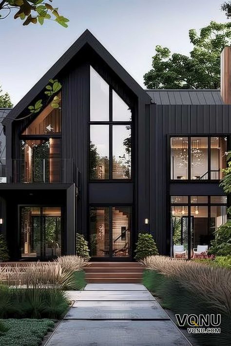 A modern black house with striking architectural design, large glass windows, and a beautifully landscaped entrance. Transitional Modern Home Exterior, Black Scandinavian House, Modern Industrial House Exterior, Black And White Modern House, Very Modern House, Modern Chalet Architecture, Black Lake House, Black Contemporary House, Modern Container House Design