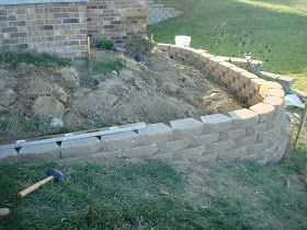 Dishing Up Design: DIY Retaining Wall & Landscaping Two Tier Front Yard Landscaping, Sloped Pathway, Corner Retaining Wall, Front Yard Retaining Wall Ideas, Retaining Wall Landscaping, Brick Retaining Wall, Retaining Wall Bricks, Brick Wall Gardens, Diy Retaining Wall