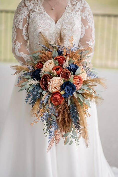 All the flowers and greenery is artificial and of high quality! September Bride Bouquet, Cascading Wildflower Bridal Bouquet, Navy Burnt Orange Wedding, Rust Navy Wedding, Fall Flowers For Wedding, Rust And Navy Blue Wedding, Western Spring Wedding, Brown And Blue Wedding, Dusty Blue Fall Wedding