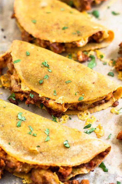 Switch up your typical taco night and make baked tacos! Tortillas are stuffed with seasoned ground meat, beans, and cheese and then baked in the oven until perfectly crispy on the outside. They make a delicious and easy taco recipe everyone will love! High in protein and gluten-free. Ground Turkey Taco Recipes, Easy Taco Recipe, Gains Recipes, Macro Dinner, Turkey Tacos Recipes, Baked Tacos, Healthy Taco Recipes, Beans And Cheese, Healthy Taco