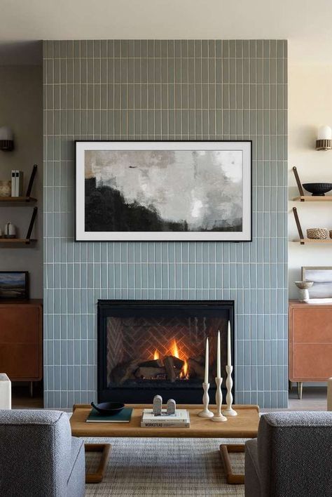 Fireplaces are a dream feature of many homes, but they can have a pretty outdated look. Get inspired by these modern fireplace ideas from interior designers. #fireplace #modernfireplace #cozyspace #interiordesign Fireplace Tile Ideas Modern White, Tall Tiled Fireplace Wall, Tile Fireplace Makeover Modern, Fireplace Mosaic Tile, Fireplace Feature Wall Ideas Modern, Simple Fireplace With Built Ins, Tiled Fireplace Ideas Modern, Simple Modern Fireplace Design, Fire Box Fireplace