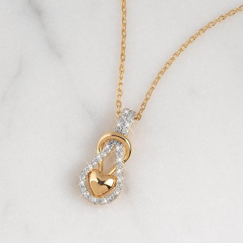 The infinity knot with a glistening puffed heart, reflects endless love in a modern way. Genuine white diamonds embellish the infinity knot and add beauty to the stunning pendant in 18kt gold-plated sterling silver. A sumptuous presentation pouch — perfect for gift-giving and safekeeping — is included at no additional charge. Real Diamond Necklace, Diamond Pendent, Infinity Knot, Jewellery Trends, Infinity Heart, Gold Ring Designs, Puffed Heart, Danbury Mint, Diamond Chain