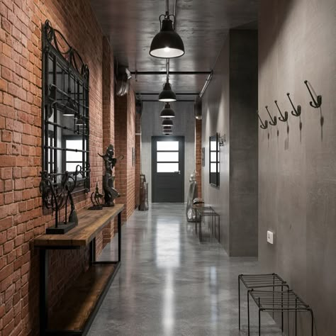 Industrial chic interiors with a cozy twist! What do you think of exposed brick walls? 🏙️💖 #interiordesign #industrialdesign #design #industrialstyle Exposed Brick Salon Spaces, Steampunk Hallway, Brick Office Space, Entrance Feature Wall, Industrial Foyer, Industrial Entrance, Red Brick Interior, Industrial Mood Board, Bagged Brick