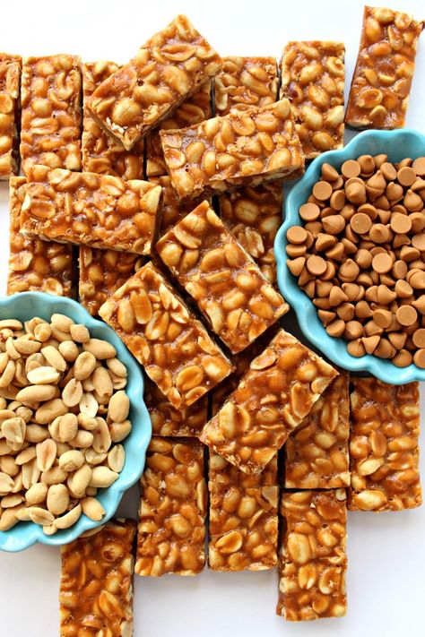 Butterscotch Peanut Bars are a sweet, chewy cookie bar that almost qualifies as candy. The buttery cookie base is crowned with salted peanuts coated in butterscotch. These shiny bars are great for party platters and cookie exchanges, as well as for filling care packages with tempting snacks.| themondaybox.com #cookies #peanuts #barcookies Peanut Bar, Butter Bar, Peanut Butter Chocolate Bars, Caramel Desserts, Peanut Butter Bars, Buttery Cookies, Salted Chocolate, Best Comfort Food, Ice Cream Toppings