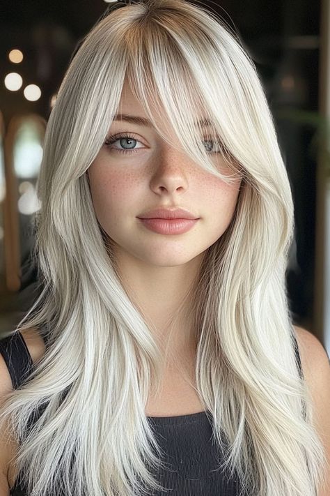 Icy Platinum Layers with Side-Swept Bangs, Trendy Long Straight Haircut Sweeping Side Bangs, Bangstyle Hair Long Side Part, Side Swept Bangs Straight Hair, Side Swept Curtain Bangs Long Hair, Modern Side Bangs, Side Bangs With Long Hair Layers, Long Bangs Side Part, Subtle Side Bangs, Long Layers With Side Swept Fringe