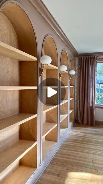 Jourdan Fairchild on Instagram: "These living room bookshelves were a *true* labor of love, and here’s digestible glimpse of what it took to build them from scratch.✨  1. We removed the original crown molding and baseboards.  2. After transporting 192,192,827 boards on top of our small SUV (#weneedatruck), Andrew built the basic framework for the shelves.  3. He extended an electrical outlet from the floor board so we could later install three sconces between the four bookshelves. That part still amazes me, tbh.  4. After much trial and error, we realized it’d be best to build the actual birch bookshelf boxes outside and then bring them in. It’s an old house, this wall bows a bit, and this reframing (ha) would give us that beautiful continuous wood piece along the back of each shelf.  5. I Bookcase Crown Molding, Built In Arch Bookcase, How To Build Bookshelves, Built In Floor To Ceiling Bookshelves, How To Build A Bookshelf Wall, Wooden Built In Bookshelves, Birch Bookshelf, Bookshelf Wall Ideas, Arched Bookshelf Built Ins