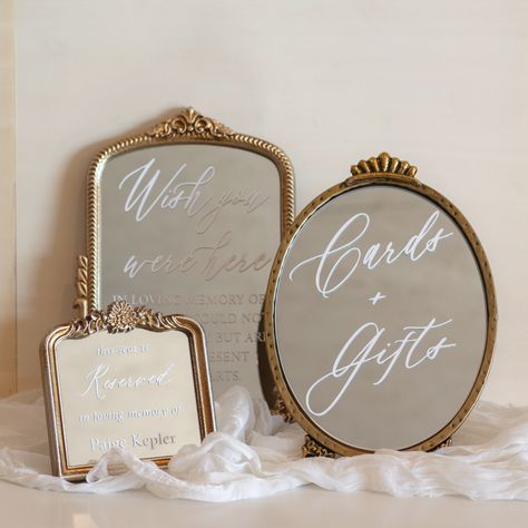 The Wedding Miniatures 🤍🪞 . . Featuring "Wish You Were Here," "Cards + Gifts," and the "Reserved Seat" from our wedding details collection! . . . #wedding #weddinginspo #weddingideas #weddingdecor #weddingsign #weddingsigns #weddingsignage #weddingsignages #weddingsignideas #weddingdetails #weddingdetailshots #weddingdecoration #weddingdecorideas #weddingstyle #weddingstyles #weddingmirror #weddingmirrors #weddingmirrorsign #etsy #Etsyshop #etsyshop #etsyfinds #etsygifts #etsystore #etsysell... Bar Sign Wedding Mirror, Vintage Mirror Wedding Decor, Mirror Decor Wedding, Mirror Sign Wedding, Elegant Wedding Signage, Newfoundland Wedding, Victorian Wedding Themes, Mirror Wedding Signs, Bride Era