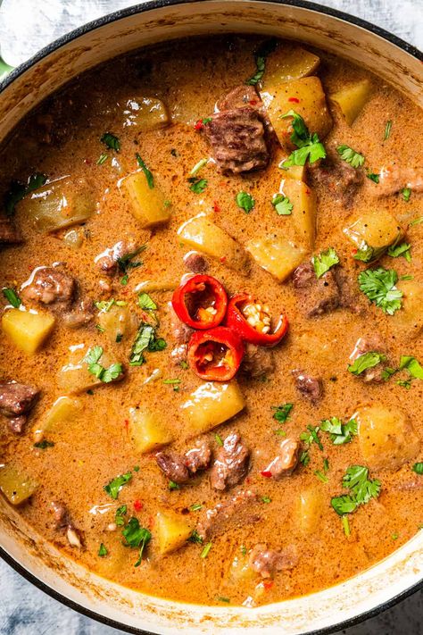 This beef Massaman curry made from scratch is pure comfort food. The rich, fragrant Thai curry is slow-cooked with tender beef chunks, potatoes, smoky chilies, and creamy coconut milk until the meat is tender and the sauce is flavorful. #massaman #thai #curry Beef And Potato Curry, Massaman Beef Curry, Thai Massaman Curry Recipe, Massaman Curry Chicken, Beef Curry Recipes, Thai Pork Curry, Lamb Massaman Curry, Coconut Beef Curry, Massaman Curry Recipe