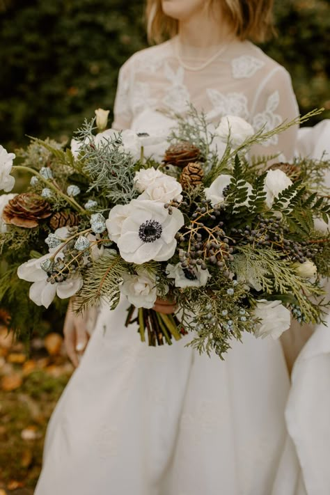 An Evergreen Winter Wedding At Axis Pioneer Square - Flora Nova Design - Premier Event Design Studio in Seattle Bridal Bouquet With Pinecones, Winter Rose Bouquet, Evergreen Winter Wedding Bouquet, Wedding Forest Flowers, Juniper Wedding Bouquet, Pinecone Wedding Bouquet, Evergreen Bridal Bouquet, Wedding Winter Bouquets, Forest Bouquet Wedding