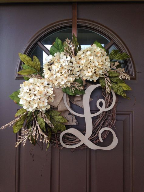 This lovely wreath will make a wonderful addition to your home decor or a thoughtful gift for a special person or occasion Beautiful wreath with 3 cream hydrangea blossoms surrounded by hydrangea and peony leaves and additional fillers , accented with double burlap bow. Made on 18 grapevine wreath base, finished product measures approximately 19-20  in diameter.  Please note that grapevine wreath base is a natural product and may differ in shape, size and overall appearance.  Add monogram of ... Cream Hydrangea, Hydrangea Wreath, Deco Floral, Everyday Wreath, Beautiful Wreath, Fall Wreaths, Handmade Home Decor, Front Door Decor, Handmade Home