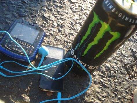 A Monster energy drink placed right next to an iPod and an old phone: 26 Pictures That Look Like Ancient Freakin' History In 2018 2000s Older Brother, 2000s Core, Older Brother Core, Midwest Emo, Emo Aesthetic, 2000s Emo, 2000s Nostalgia, Party Rock