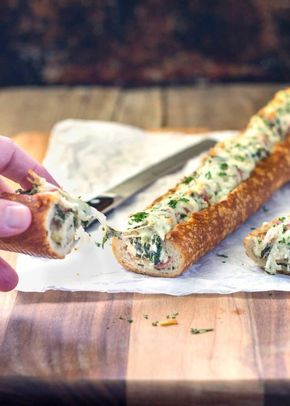 This easy, cheesy, creamy feta and spinach stuffed french bread is deliriously rich and tasty. It reminds me of a Greek spanakopita but all stuffed inside a wonderful sourdough bread loaf. Perfect hand held appetizer for parties or the holidays! www.keviniscooking.com Sourdough Bread Loaf, Greek Spanakopita, Stuffed French Bread, Creamy Feta, French Bread Recipe, Bread Loaf, Buffalo Chicken Dip, Easy Cheesy, French Bread