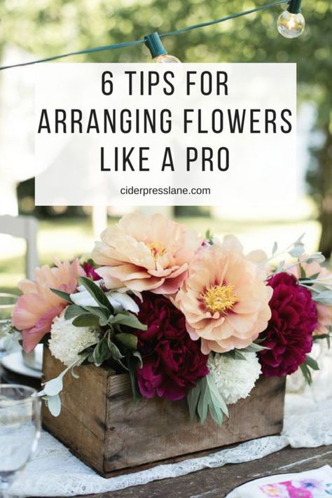 Six Tips For Arranging Flowers Like A Pro because we all need a little help looking professional! #floraldesign #flowerarranging #flowers #certerpieces #tablescapes #eventdesign #floral #springdesign #howto #howtoarrangeflowers #arrangingflowers #creatingcenterpieces #dinnerparty #tabledesign #gather #community #hosting #hostingtips #hostingaparty #partydecor #decor #floraldecor #easyflowerarranging Flower Arrangements Inspiration, Containers For Flower Arrangements, Easy Fall Floral Arrangements, Bouquet Without Flowers, Modern Flower Arrangements Centerpieces, Floral Mechanics, Floral Workshop, Fake Flower Arrangements, Baby Pumpkin