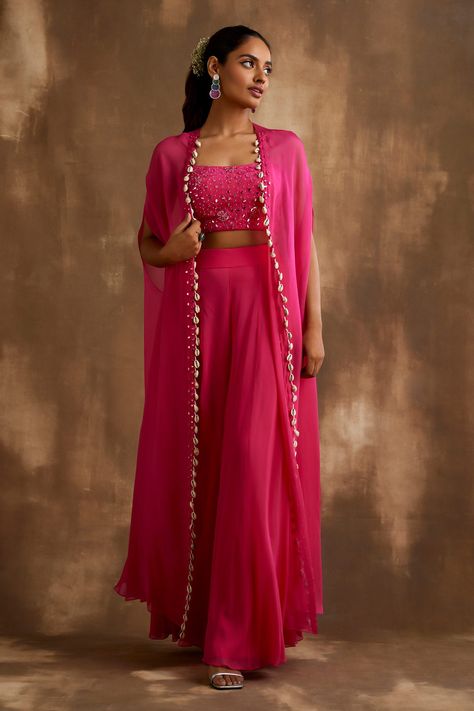 Shop for these amazing collections of Pink Georgette Embroidered Mirrorwork Cape: Embellished Blouse Set For Women by Niamh By Kriti online at Aza Fashions. Pink Indowestern Outfits, Pink Indo Western Dresses, Suit Ideas For Women Indian Wedding, Outfits For Sangeet Indian Weddings, Pink Ethnic Outfits, Pink Haldi Outfit, Indian Sangeet Outfit, Pink Traditional Outfit, Indian Western Outfits