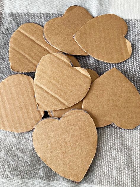 Yarn Wrapped Cardboard Hearts, Yarn Hearts Craft, Heart Cardboard Crafts, Handmade Valentines Decorations, Heart Gifts Diy, Diy Valentine Wall Decor, Pom Pom Hearts, Decorating Wooden Hearts, Yarn Heart Garland