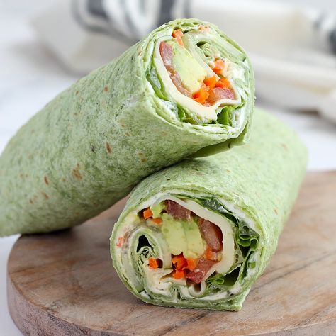 Our Veggie Wraps are made with a delicious, homemade herbed cream cheese and are packed with lots of fresh vegetables. It's a healthy and easy recipe that can be made ahead and are perfect for packed lunches! Green Wraps Tortilla, Wrap Rolled Sandwiches, Cream Cheese Veggie Wrap, Easy Veggie Sandwiches, High Protein Veggie Wraps, Easy Veggie Wraps, Veggie Burrito Wraps, Vegetarian Lunch Wraps, Veggie Wraps Easy