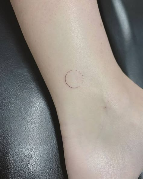 Small and minimalist sun and moon ankle tattoo Minimal Circle Tattoo, Circle Fine Line Tattoo, Single Needle Moon Tattoo, Minimalist Circle Tattoo, Circle Line Tattoo, Simple Circle Tattoo, 3 Lines Tattoo, One Needle Tattoos, Circular Tattoo Placement