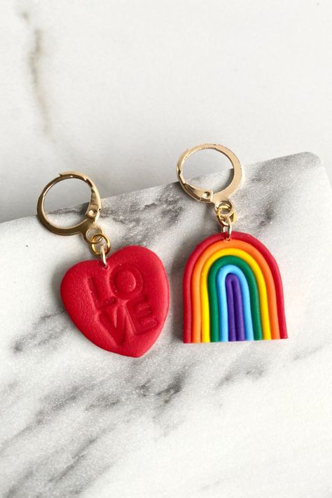 Polymer Clay Earrings: left side is a Red Heart with the word "Love" engraved, Right side a colourful rainbow with the colours of the pride flag. Pride Jewelry, Pride Jewellery, Heart Earring, Clay Diy Projects, Love Rainbow, Love Is Love, Diy Clay Crafts, Cold Porcelain, Moon Art