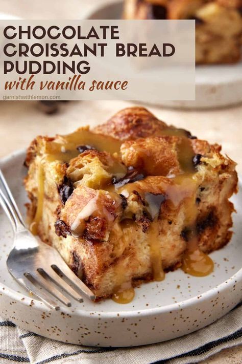 Buttery, flaky pastries make this easy, make-ahead Chocolate Croissant Bread Pudding with Vanilla Sauce stand out from the rest! Toasted croissant pieces are baked in a fragrant custard sauce, dotted with rich chocolate chunks and drizzled with a warm vanilla butter sauce for the ultimate comfort food dessert recipe. Bread Pudding With Chocolate Sauce, Bread Pudding Cookies, Brown Butter Bourbon Bread Pudding, Chocolate Croissant Bread Pudding Recipe, Croissant French Toast Muffins, Crossaint Bread Pudding Desserts, Chocolate Bread Pudding Recipe Best, Bread Pudding Made With Croissants, Bread Pudding Chocolate