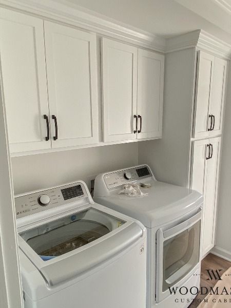 #woodmastercustomcabinets #customcabinets #cabinetshop #cabinetmaker #interiordesign #builtin #builtins #raleighnc #durhamnc #wakecounty #northcarolina #houzz #myhouzz #customdesign #interiors #laundryroom #laundryroomgoals #laundryday #laundrycabinets #shakercabinets #whitecabinets #blackhardware Laundry Room Built Ins Stackable, Storage Around Washer And Dryer, Shallow Laundry Room Cabinets, Laundry Room Hanging Bar Between Cabinets, Small Laundry Room Ideas Tall Cabinet, Cabinets Above Washer And Dryer Laundry Room, Adding Storage To Laundry Room, Garage Laundry Cabinets, Small Laundry Room With Drop Zone