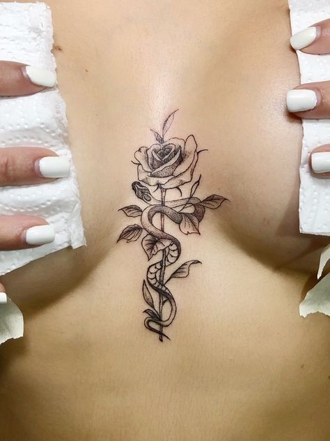 Snake On Ribs Tattoo, Tattoo Ideas Female Chest For Women, In Between Breast Tattoos For Women, Tattoo Sur Les Cotes, Tattoo Between Breast Women, Baddie Tats Under Breast, Rose Tattoo Between Breast, Marija Core, Tatoos Woman Ideas