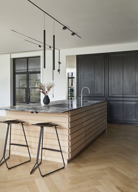 This kitchen features a contemporary 'Hygge' style island with sleek horizontal oak drawers, all topped with a beautiful marble worktop. The design blends modern simplicity with natural materials, creating a cosy and elegant centerpiece for the space! #scandidesign #scandikitchen #bespokekitchens https://www.solakitchens.com/majestic-charcoal/