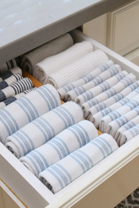 Kitchen Drawer Glass Organizer, Minimalist Kitchen Cabinets Organization, Storage Under Farmhouse Sink, Kitchen Towel Storage Ideas Drawers, Kitchen Towels Organization Ideas, Kitchen Rag Storage, Storing Kitchen Towels, Kitchen Towels Storage Ideas, How To Organise Kitchen Drawers