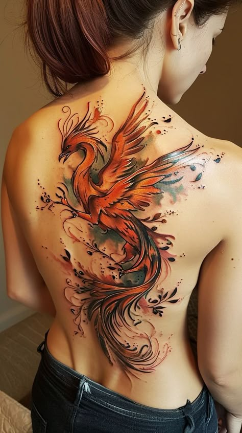 Phoenix tattoo design on woman's back featuring vibrant colors and intricate details, symbolizing rebirth and transformation. Free Bird Tattoo, Phoenix Back Tattoo, Rebirth Tattoo, Japanese Phoenix Tattoo, Phoenix Bird Tattoos, Phönix Tattoo, Phoenix Artwork, Woman's Back, Phoenix Tattoos