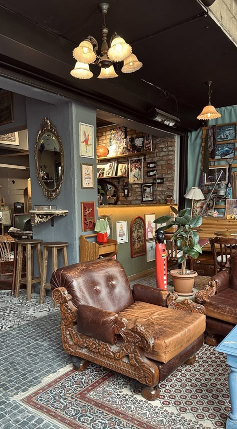 Coworking Space Coffee Shop, Coffee Shop Living Room Design, Coffee Shop With Stage, Small Cozy Cafe Interior, Coffee Shop Vintage Design, Thrifted Coffee Shop, Thrift Store Coffee Shop, Vintage Modern Coffee Shop, Antique Shops Aesthetic