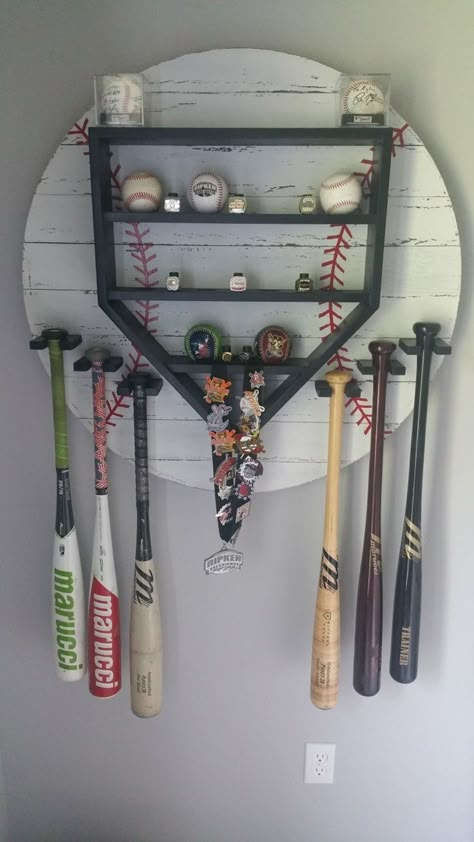 23 Insanely AWESOME Baseball Fan Cave Ideas! (Game Day Ready) — Nikki Lo Baseball House Decor, Baseball Bat Shelf, Baseball Display Shelf, Baseball Shelf Display, Rustic Baseball Room, Baseball Bat Display Ideas, Baseball Storage Ideas, Softball Trophy Display Ideas, Baseball Trophy Display Ideas