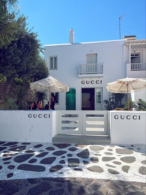 Gucci store in Mykonos, Greece Mykonos Boutique Store, Mykonos Greece Aesthetic, Mykonos Airport, Mediterranean Farmhouse, Restaurant Exterior Design, Restaurant Exterior, Building Aesthetic, Tree Lamp, Store Design Boutique