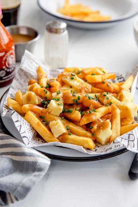 Poutine is a delicious Canadian recipe made with french fries, gravy, and cheese. This irresistible main dish or snack is made in under 30 minutes. #jernejkitchen #frenchfries #homemadepoutine #canadian Halloumi Cheese Recipes, Poutine Fries, Pasta Fatta In Casa, Canadian Food, Poutine, Beautiful Food Photography, Best Comfort Food, Creamy Soup, Ravioli