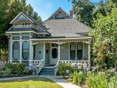 For sale: $759,000. This amazing 1887 Queen Anne Victorian cottage surrounded by a white picket fence is The Stevenson House, City Historic Landmark #83, offering big property tax savings through the Mills Act. The exterior redwood siding & sawn and turned decorative work have been painted an authentic 7-color Victorian palette. The front porch features stick & ball pattern woodwork & spindle gallery. Inside the stained glass front door you'll find 12' ceilings & a hallway with anaglypta wall... Victorian House Colors, Victorian Porch, Victorian Exterior, Storybook House, Folk Victorian, Victorian Style Homes, Wood Details, Homes Exterior, Victorian Cottage