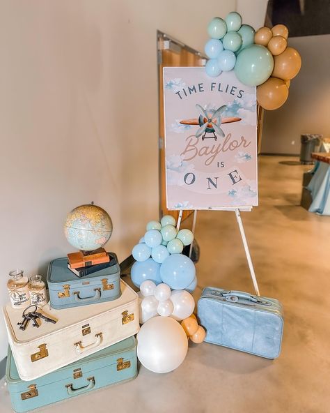 Time Flies When You’re Turning One ✈ | @katieramsey.studiok IN LOVE with Baylor’s 1st birthday!!!🥳 Dreamy vintage travel-inspired theme, complete with clouds, vintage suitcases, and adorable framed signage. Every detail was filled with love and adventure! ✨ ⭑ Suitcases and trinket rentals: @abushelandapeckvintagerentals Ready to create unforgettable memories for your little one’s special day? Let us help you bring your vision to life! 🎈🔗 ✨ | #TimeFlies #FirstBirthday . . . . #Celebrate... Airplane Dessert Table, 1st Birthday Travel Theme, Travel 1st Birthday Party, Time Flies 1st Birthday Party, Plane Party Ideas, Plane Birthday Theme, Time Flies When You’re Turning One, Vintage 1st Birthday Boy, Oh How Time Flies First Birthday