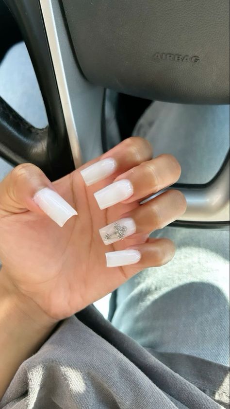 Cute White Nails French Tip, White Nails With Planet Charm, Milky White Nails With Cross, Plain White Nails With Charms, Milk White Nails With Rhinestones, White Nails With Cross Charm, Milky White Nails With Gems, White Nails Charms, White Charm Nails