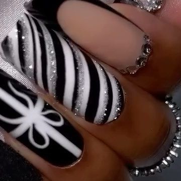 #1 HIGHEST QUALITY PRESS ON NAILS on Instagram: "Let’s welcome: Blk Candy Cane 🖤 - Christmas nails but in black!😮‍💨🖤…. Question? Who likes wearing Christmas nails? 🎁 this has been a debate.😮‍💨 - 🖤 Size shown L- L Square 🖤 M & L Lengths available 🖤 Available Now 🖤 RINGS: @iiceheaven 🔥🔥🙌🏽🖤 - - - Website link in bio.🖤 - #christmasnails2023 #nailsofinstagram #blackchristmas #blackchristmasnails #lnails #blackpressonnails #christmaspressonnails #queengawayacollection #queengawaya" Holiday Nails Black And White, Black Candy Cane Nails, Red Black Christmas Nails, White And Black Christmas Nails, Black White Christmas Nails, Black And Silver Christmas Nails, Emo Christmas Nails, Red And Black Christmas Nails, Black Nails Christmas