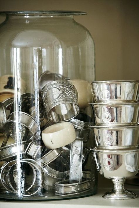 Have you inherited some vintage silver, brass or copper pieces and have no idea what to do with them or how to display them in your more modern space? If you have some sentimental pieces sitting in a box collecting dust, here's how to incorporate them into your everyday decor. You'll look at those old silver creamers at the thrift shop in a whole new light. Silver Display, Silver Napkin Rings, Silver Bowl, Silver Trays, Silver Decor, Vintage Silverware, Silver Spoons, Silver Lining, Silver Pieces