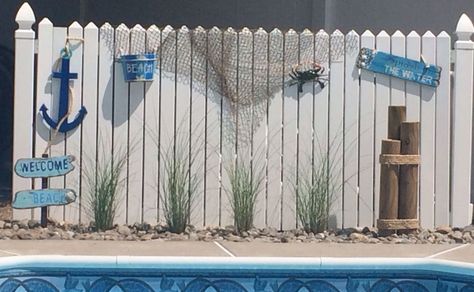 Beach Theme Outdoor Decor Patio, Beachy Backyard Pool, Beach House Privacy Fence, Beach Theme Landscape Ideas, Beach Theme Pool Area, Diy Beach Decor Outdoor, Pool Fence Decorating Ideas, Nautical Fence Ideas, Beach Theme Hallway