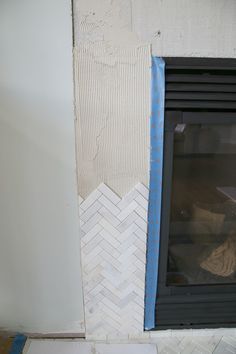 How To Tile A Fireplace, Fireplace Tile Trim, Diy Tile Fireplace Surround, Diy Tile Fireplace, Marble Herringbone Fireplace, Large Tile Fireplace, Herringbone Fireplace Surround, Herringbone Tile Fireplace, Tile Fireplace Surround