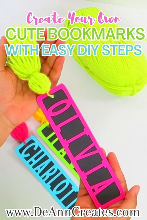 This image shows a pair of hands holding a colorful bookmark with a tassel while two other bookmarks lay on the surface below.  There is also a ball of lime green yarn near the bookmarks as well. Diy Name Bookmark, Cardstock Bookmarks Cricut, Easy Paper Bookmarks, Making Bookmarks With Cricut, Cricut Projects Bookmarks, Panda Bookmark Diy, Diy Bookmarks Printable, Preschool Cricut Ideas, Easy Cricut Crafts To Sell