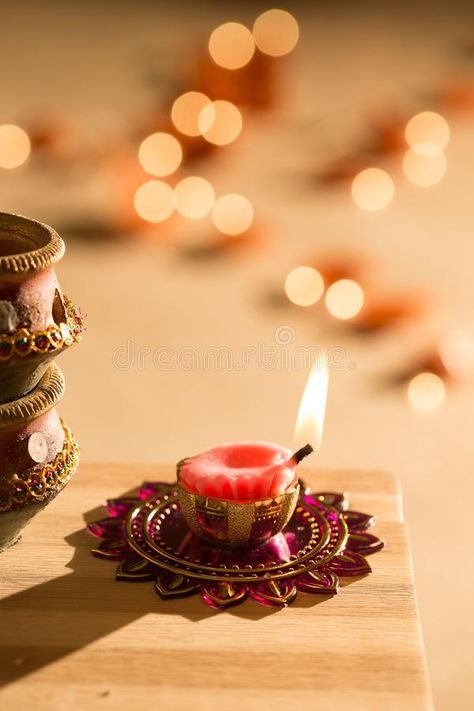 Photo about Diwali lights placed nearby diyas in low light. Image of festival, indian, celebrations - 100281499 Diwali Product Shoot, Diwali Campaign, Diyas Diwali, Diwali Shoot, Sweets Photography, Diwali Wallpapers, Diwali Diyas, Happy Diwali Wallpapers, Diwali Pooja