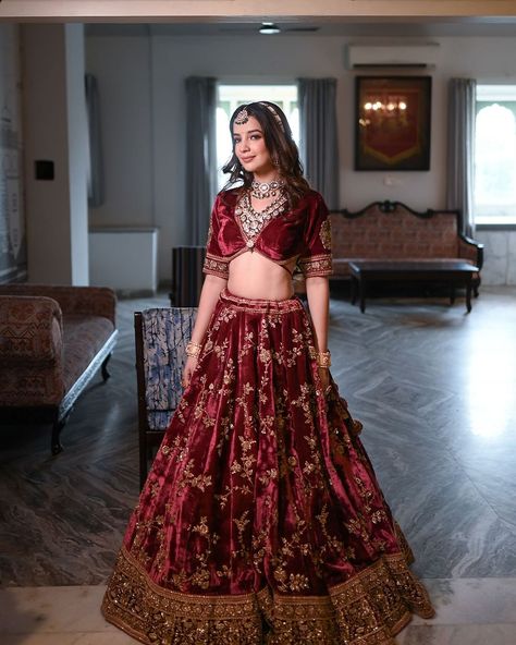 Feel elegant in our Maroon Velvet Lehenga, beautifully embroidered with Aari Tari designs. ✨  Perfect for special occasions, its rich velvet fabric and intricate details add sophistication. ❤️  Step into timeless beauty and make a statement effortlessly with this stunning outfit.  Talent : @vaishnavi_sharma_19 Makeup : @makeup_paayal . . . #aaritari #outfits #red #velvet #wedding #outfits #women #style #weddingoutfits #lehengas #womenfashion #lehengasinspiration Velvet Red Lehenga, Bridal Lehenga Red Royal, Wedding Outfits Women, Red Velvet Lehenga, Maroon Velvet Lehenga, Velvet Lengha, Red Velvet Wedding, Maroon Lehenga, Desi Clothing