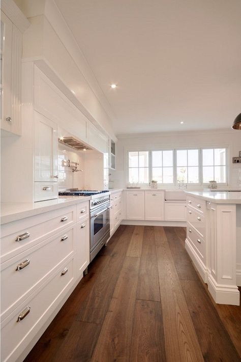 Clean white kitchen design with wood floor Luxury White Kitchen Design, Luxury White Kitchen, Hardwood Plank Flooring, Timeless Kitchen Design, Wood Floor Kitchen, Wood Floors Wide Plank, Timeless Kitchen, Wood Laminate Flooring, Flooring Inspiration