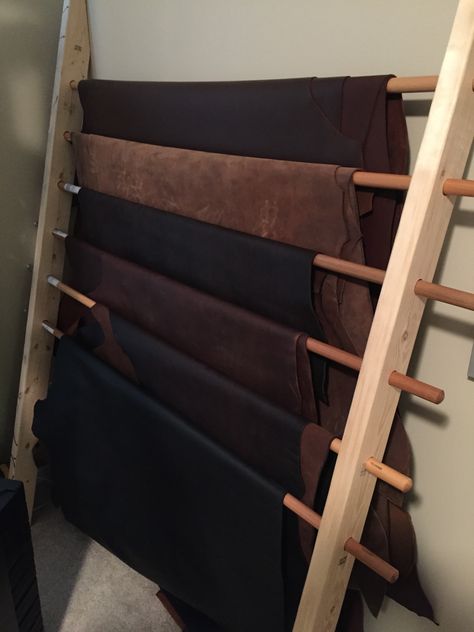 Sturdy Leather Wrack: 2x4s and replacement broom handles Leather Craft Studio, Leather Store Design, Leather Hide Storage Ideas, Leather Workshop Ideas Design, Leather Working Station, Leather Storage Ideas, Leather Workshop Studio, Leather Workshop Ideas, Leather Studio