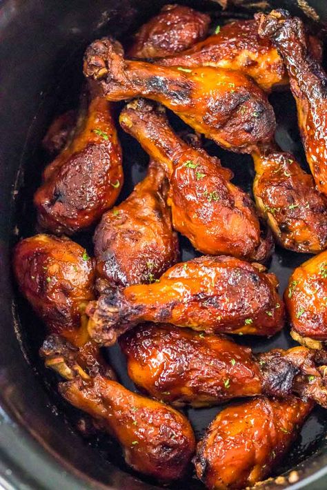 Get ready to sink your teeth into tender and flavorful slow cooker BBQ chicken legs. With minimal effort, these juicy drumsticks are coated in a tangy and smoky barbecue sauce that everyone will love. Perfect for busy days or laid-back gatherings, this easy slow cooker recipe is a crowd-pleaser that'll keep you coming back for more! Slow Cooker Chicken Barbecue, Chicken Legs For A Crowd, Chicken Drumsticks Slow Cooker Recipes, Bbq Chicken Legs Crockpot Drumstick Recipes, Slowcooker Drumsticks Crock Pot, Chicken Legs In Slow Cooker, Barbecue Chicken Legs In Crockpot, Slow Cooker Bbq Chicken Drumsticks, Crockpot Bbq Chicken Legs Easy